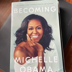 “Becoming” by Michelle Obama, paper back book.
